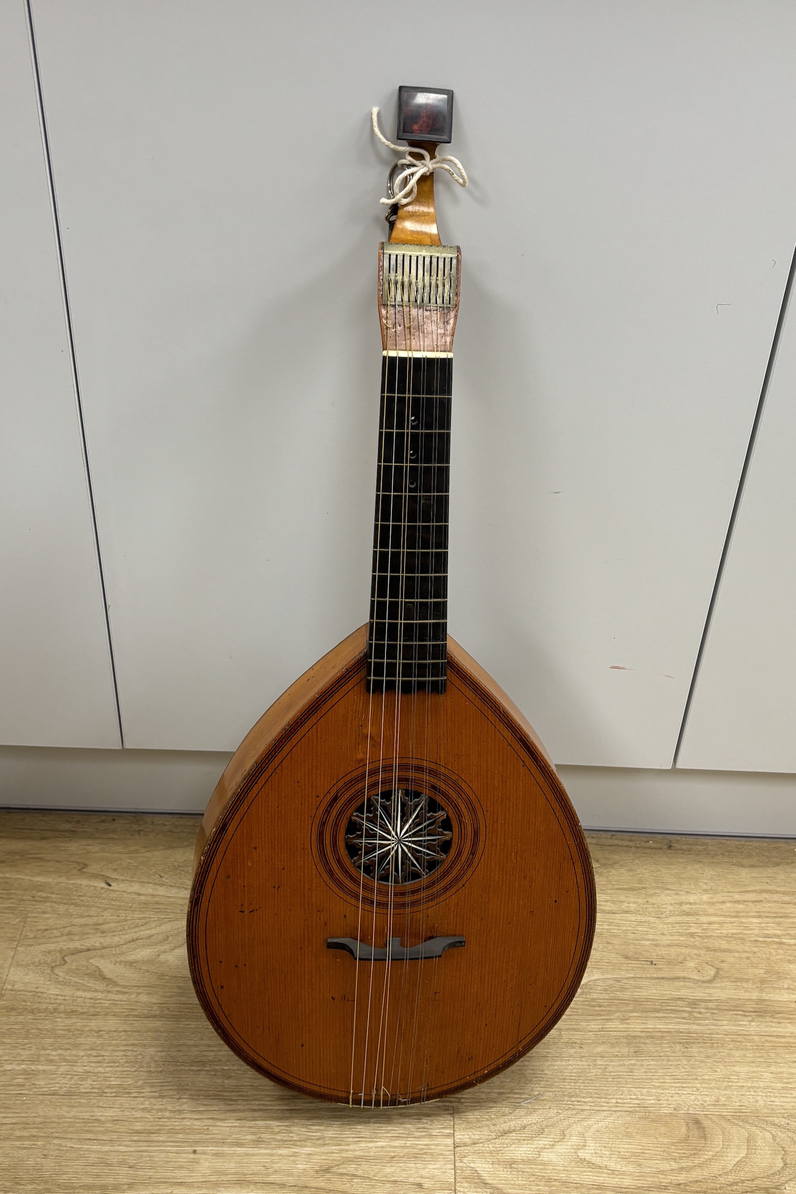 An 18th century English guitar, c.1760-80, possibly of London manufacture by Preston or Hintz, with ten watch key tuned strings, with maple back and neck, spruce soundboard, three original square section holes intended f